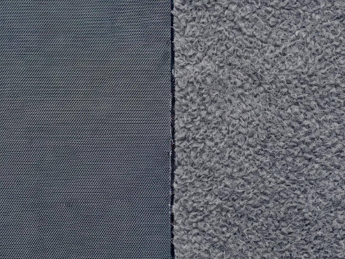 Close view of a mid-weight softshell fabric face and its handle