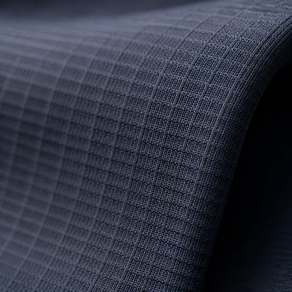 Close-up of a technical performance fabric structure built for repeated flex