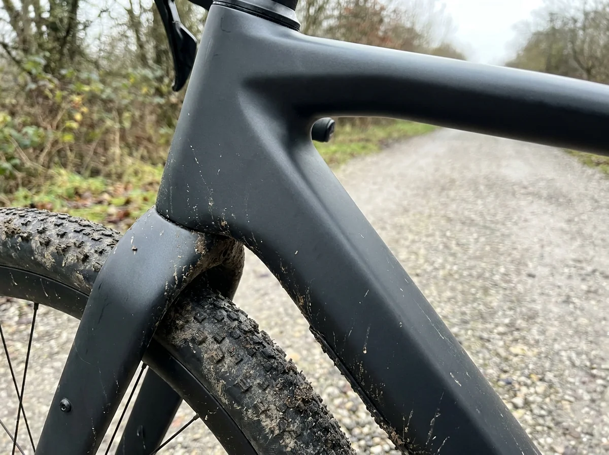 Loaded gravel bike frame at the height a jersey hem passes it