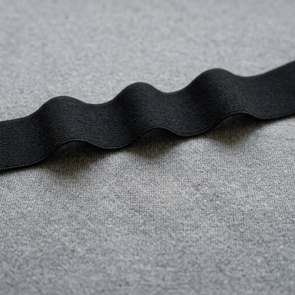 Structure card: a dense twill face folded into a soft curve
