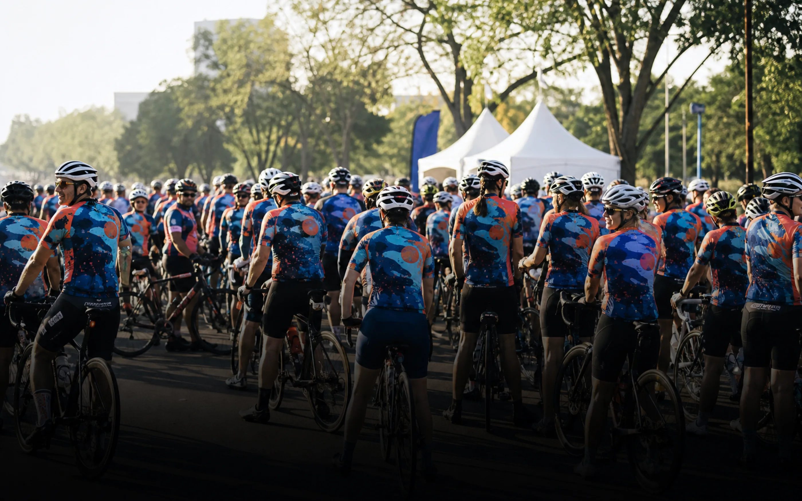 Large group of riders at the start of an organized cycling event