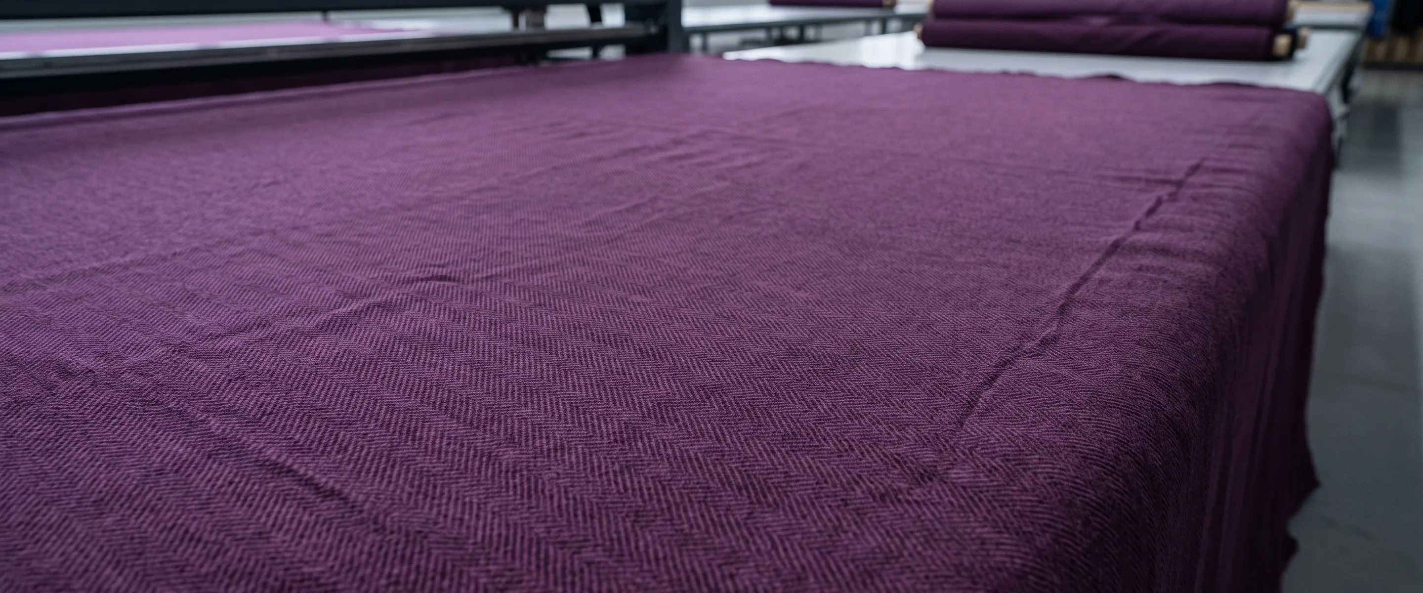 A deep purple woven fabric surface