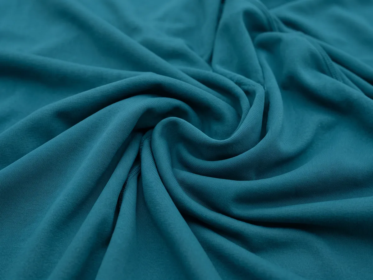 Folds of a teal stretch fabric