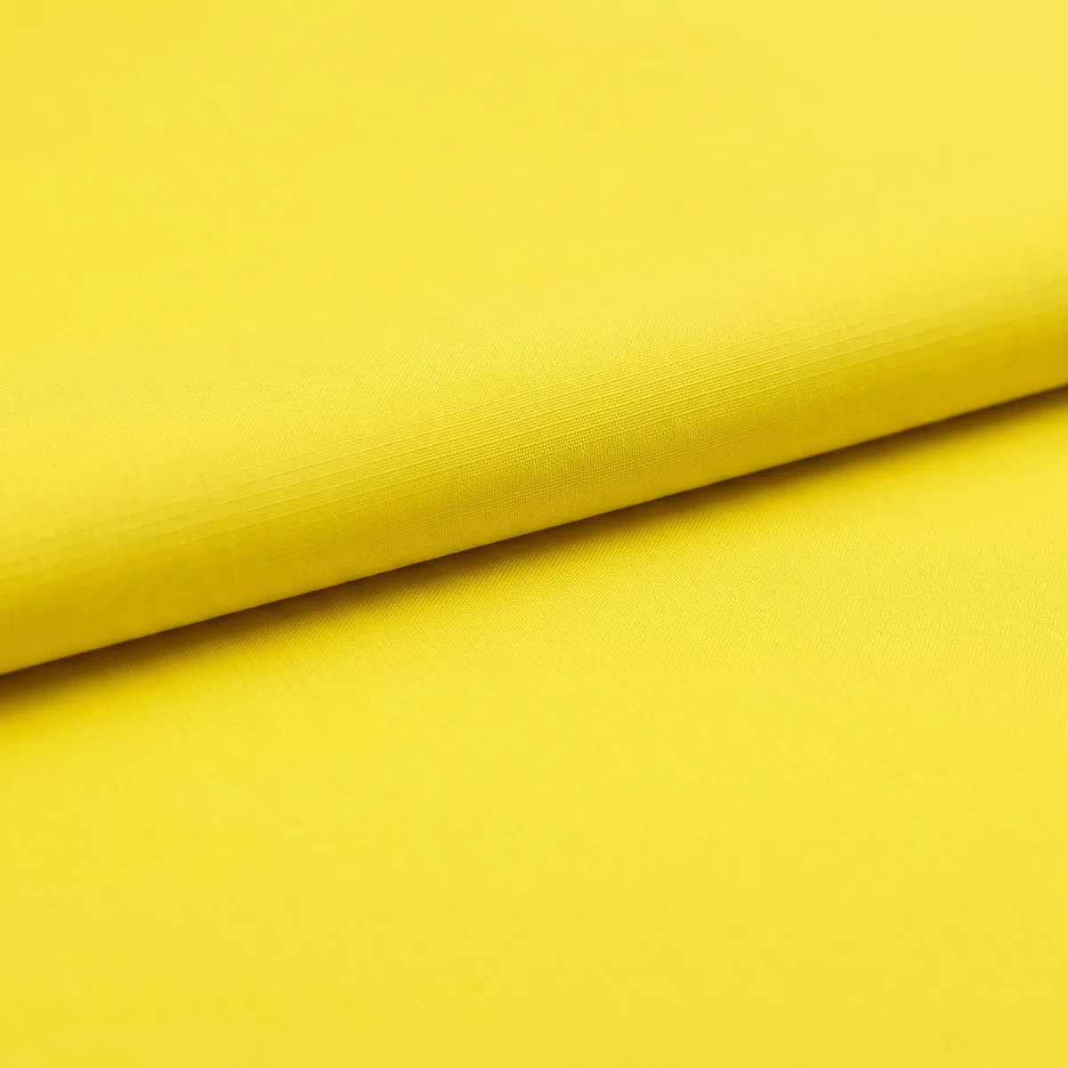 A single fold in a bright yellow fabric
