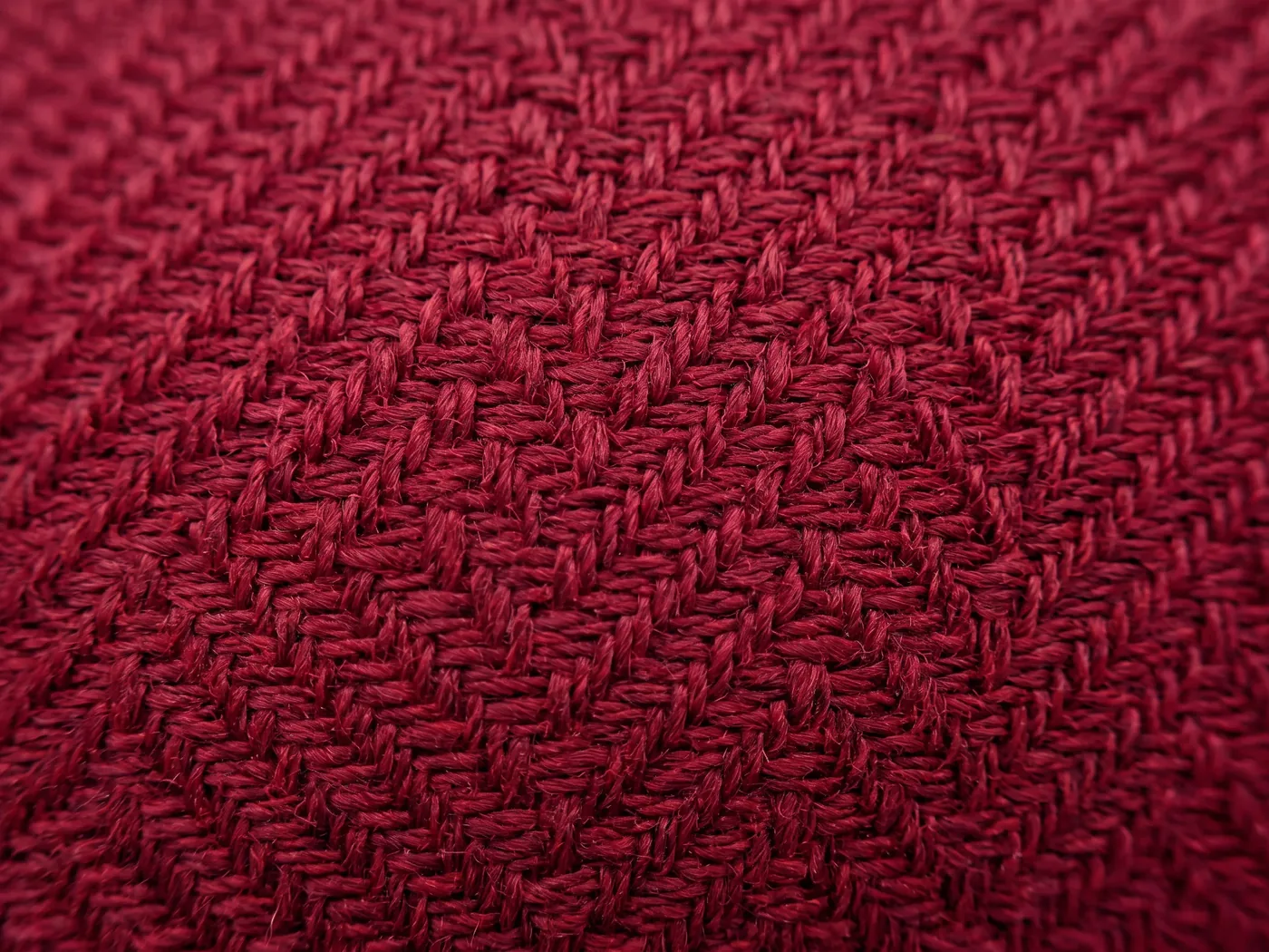 Macro of a deep crimson woven fabric surface