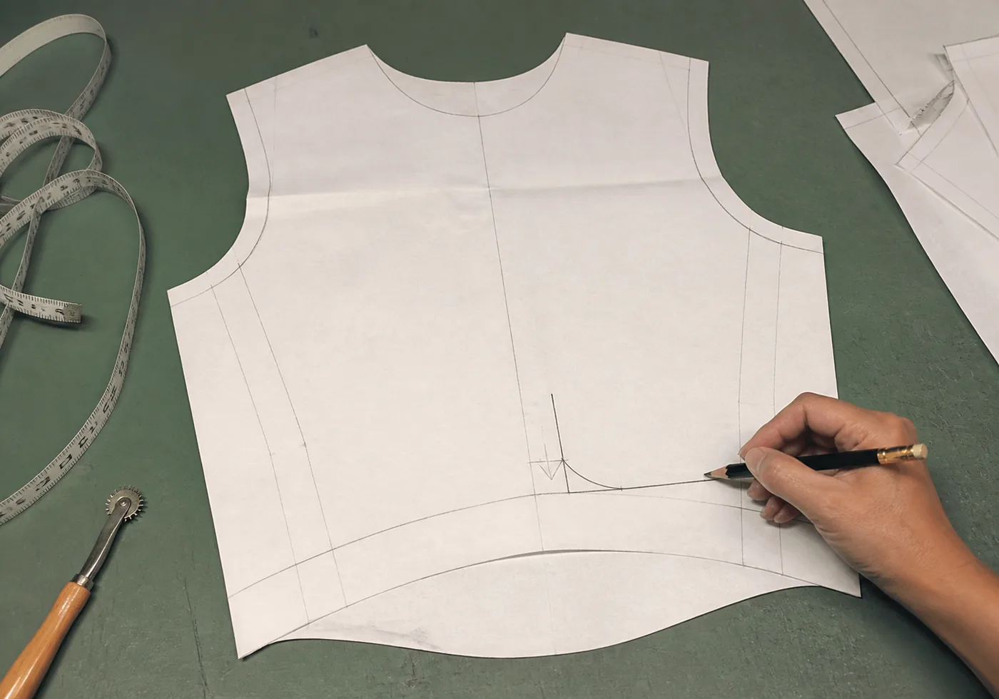 Pattern piece for a road cycling jersey showing an extended front rise for a forward-leaning riding posture