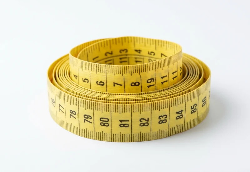 Coiled tailor's tape showing centimetre graduations